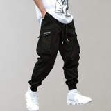 Tomáš – Pánske Cargo Joggingové Nohavice – Fialové Streetwear Nohavice s Kapsami na Zips a Náplety