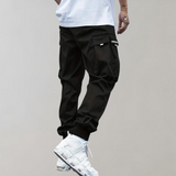 Tomáš – Pánske Cargo Joggingové Nohavice – Fialové Streetwear Nohavice s Kapsami na Zips a Náplety