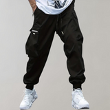 Tomáš – Pánske Cargo Joggingové Nohavice – Fialové Streetwear Nohavice s Kapsami na Zips a Náplety