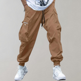 Tomáš – Pánske Cargo Joggingové Nohavice – Fialové Streetwear Nohavice s Kapsami na Zips a Náplety