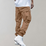 Tomáš – Pánske Cargo Joggingové Nohavice – Fialové Streetwear Nohavice s Kapsami na Zips a Náplety